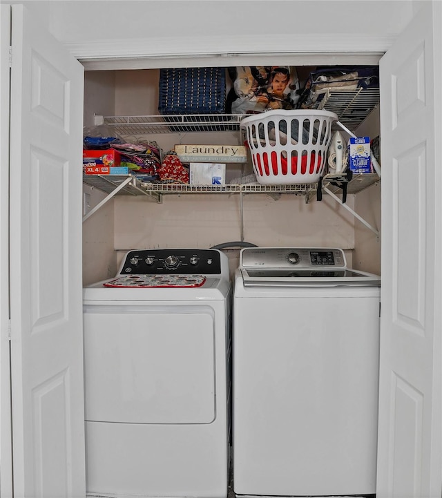 laundry room with washing machine and dryer and laundry area