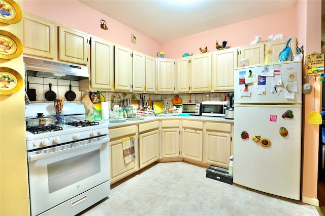 kitchen featuring white appliances, light countertops, decorative backsplash, light floors, and under cabinet range hood