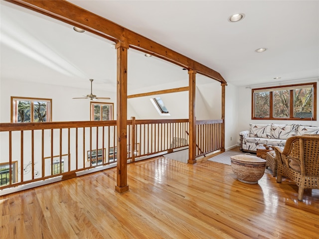 living area with recessed lighting, a ceiling fan, wood finished floors, and baseboards