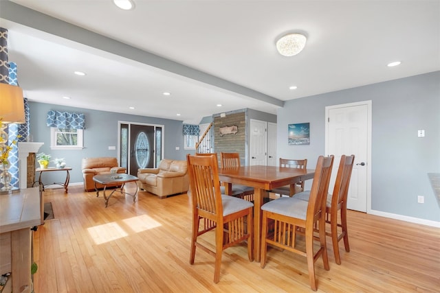 dining room with stairway, baseboards, recessed lighting, and light wood-type flooring