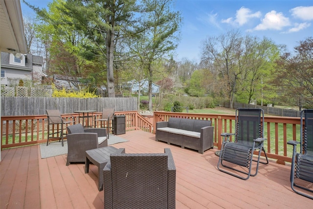 deck featuring a fenced backyard