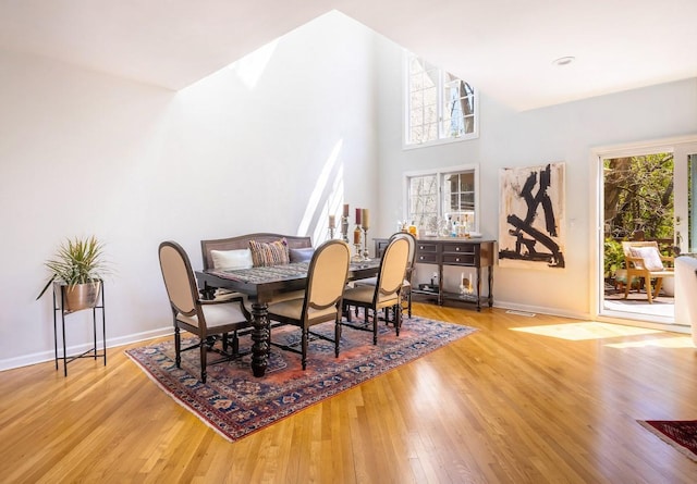dining area featuring wood finished floors and baseboards