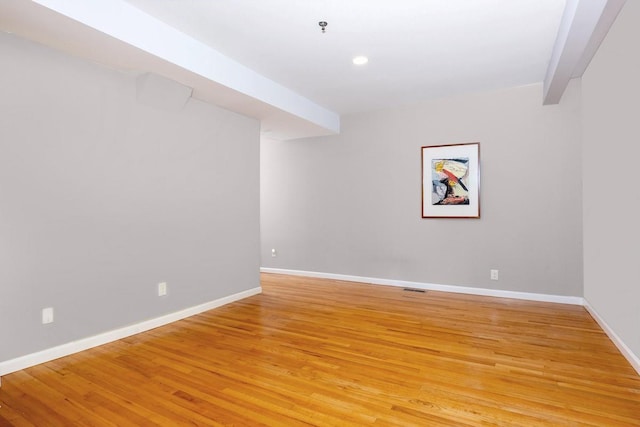 finished basement with light wood-style flooring, baseboards, and recessed lighting