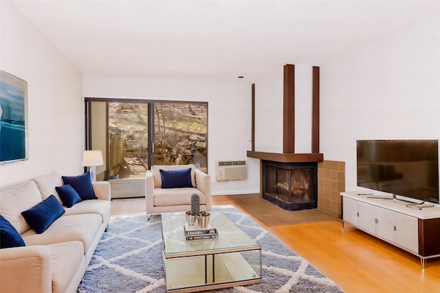 52 Round Hill Rd, Dobbs Ferry, NY 10522 - living room with a multi sided fireplace and wood finished floors