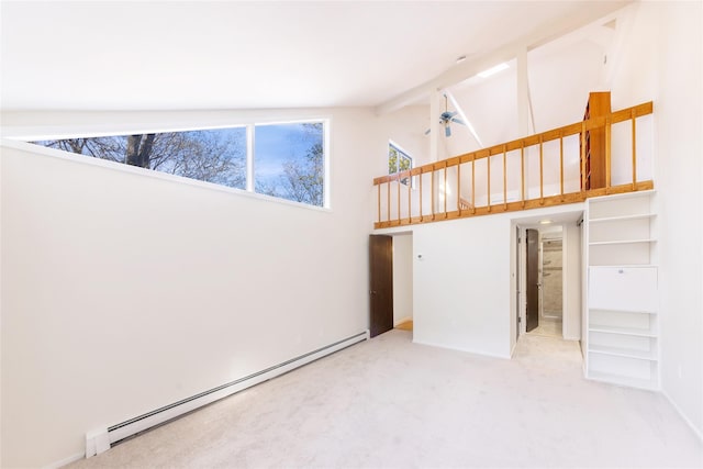 52 Round Hill Rd, Dobbs Ferry, NY 10522 - carpeted empty room featuring beamed ceiling, high vaulted ceiling, baseboards, and baseboard heating