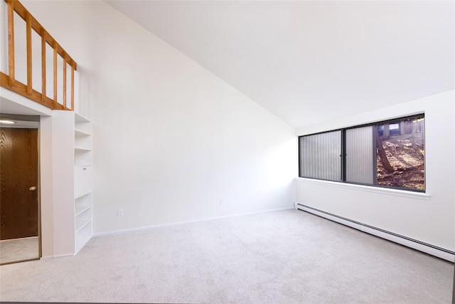 52 Round Hill Rd, Dobbs Ferry, NY 10522 - carpeted empty room featuring high vaulted ceiling, a baseboard heating unit, and baseboards