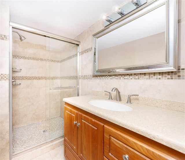 52 Round Hill Rd, Dobbs Ferry, NY 10522 - bathroom featuring vanity, tile walls, tasteful backsplash, and a stall shower