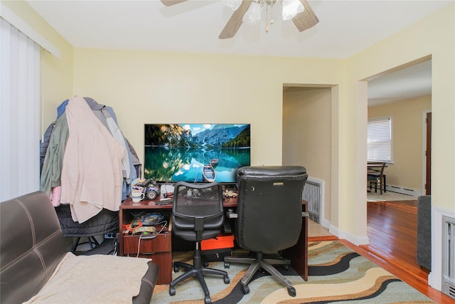 16 Alberta Ave, Staten Island, NY 10314 - office area with baseboard heating, ceiling fan, and wood finished floors