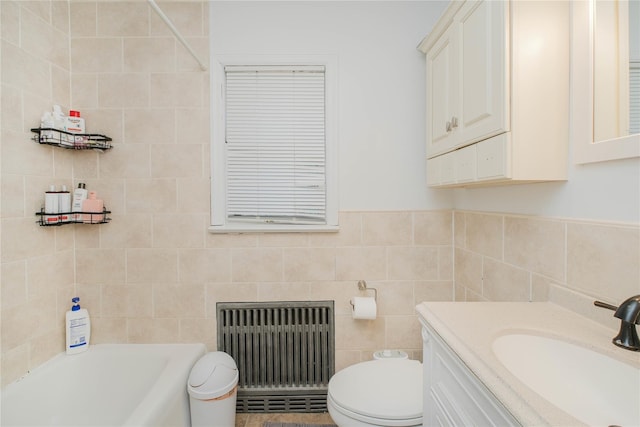 16 Alberta Ave, Staten Island, NY 10314 - bathroom with toilet, radiator heating unit, a bathing tub, and tile walls