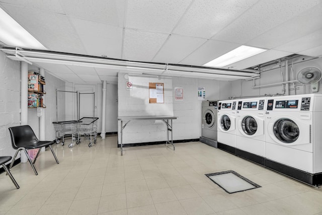 common laundry area with concrete block wall