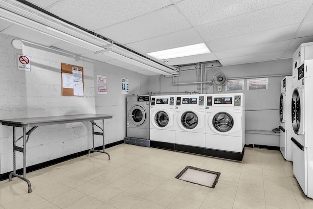 common laundry area featuring independent washer and dryer