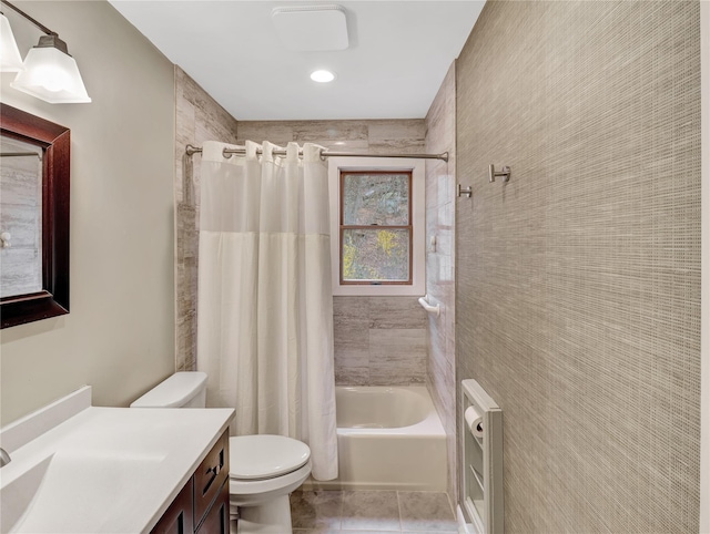 bathroom featuring shower / bathtub combination with curtain, toilet, vanity, and tile patterned floors