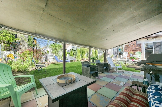 sunroom / solarium with an outdoor fire pit