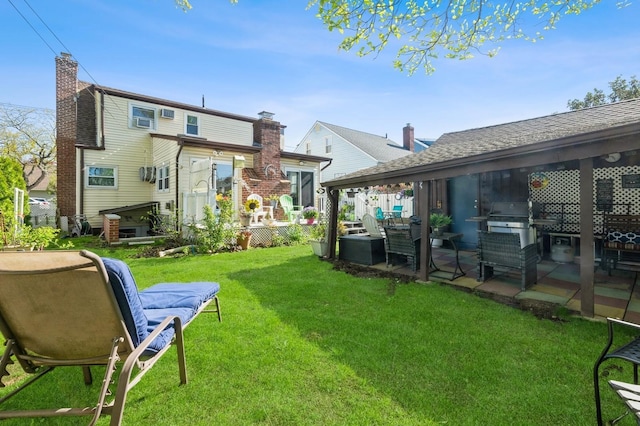 rear view of house with a patio area and a yard
