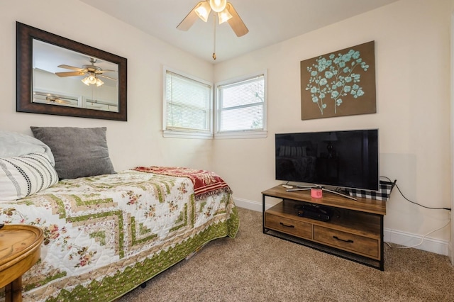carpeted bedroom with baseboards and ceiling fan