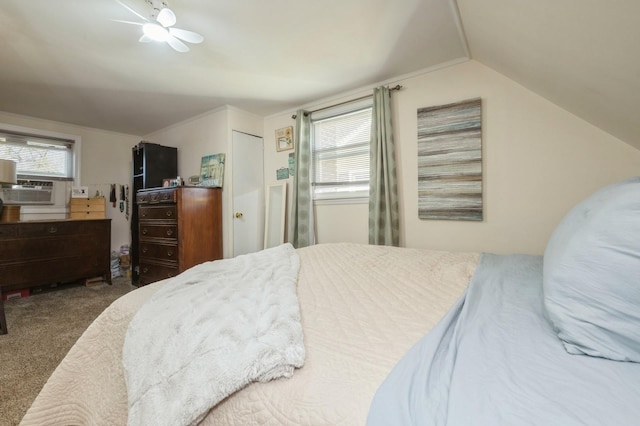 bedroom featuring carpet floors, cooling unit, vaulted ceiling, and multiple windows