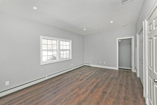 unfurnished bedroom with a baseboard heating unit, baseboards, dark wood-style floors, and recessed lighting