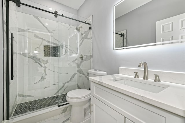 bathroom featuring marble finish floor, vanity, a marble finish shower, and toilet