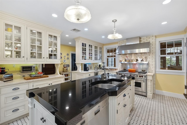 1271 Beverly Rd, Douglaston, NY 11363 - kitchen featuring a sink, dishwashing machine, luxury range, wall chimney exhaust hood, and visible vents
