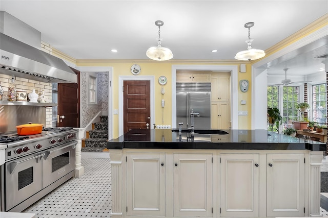 1271 Beverly Rd, Douglaston, NY 11363 - kitchen with dark countertops, crown molding, a sink, high end appliances, and wall chimney exhaust hood
