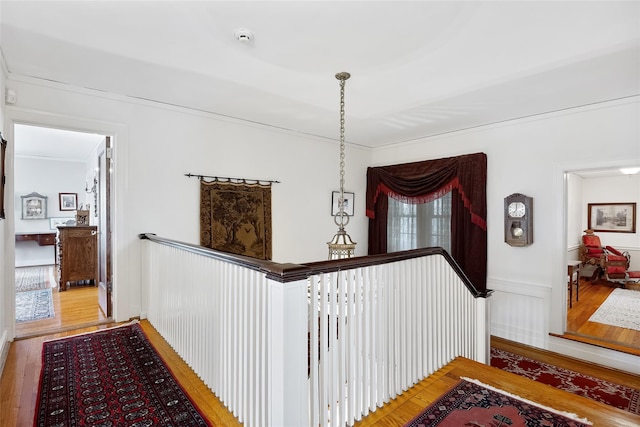 1271 Beverly Rd, Douglaston, NY 11363 - hallway with wood finished floors, an upstairs landing, and crown molding