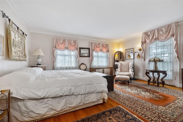 1271 Beverly Rd, Douglaston, NY 11363 - bedroom featuring wood finished floors and crown molding