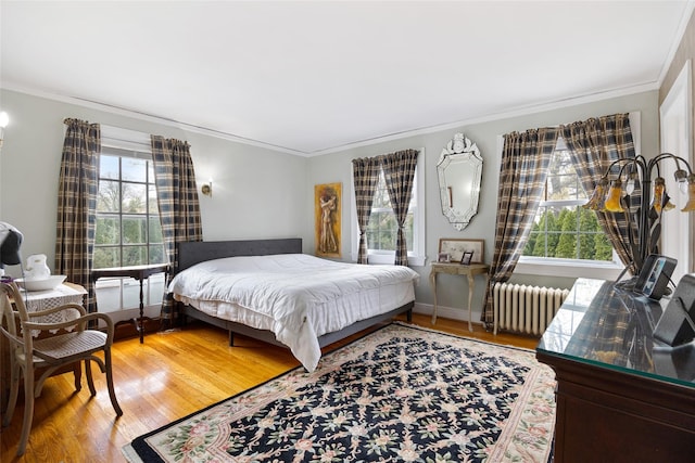 1271 Beverly Rd, Douglaston, NY 11363 - bedroom with radiator, wood finished floors, and ornamental molding