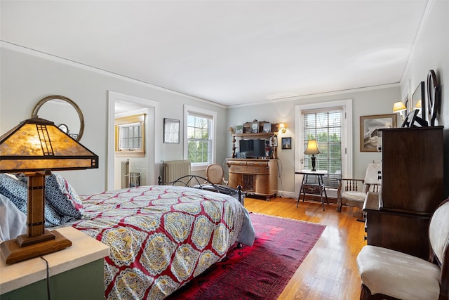 1271 Beverly Rd, Douglaston, NY 11363 - bedroom with ornamental molding, light wood-style floors, and radiator heating unit