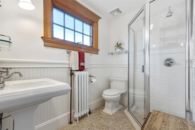 1271 Beverly Rd, Douglaston, NY 11363 - full bath featuring a wainscoted wall, toilet, visible vents, radiator heating unit, and a shower stall