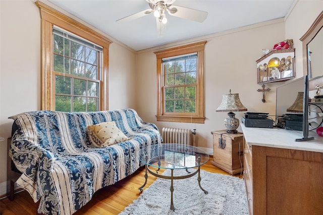 1271 Beverly Rd, Douglaston, NY 11363 - living area with radiator heating unit, ornamental molding, wood finished floors, and ceiling fan