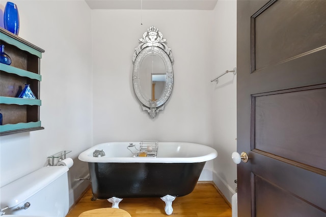 1271 Beverly Rd, Douglaston, NY 11363 - bathroom with a freestanding bath, baseboards, toilet, and wood finished floors