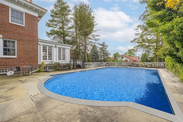 1271 Beverly Rd, Douglaston, NY 11363 - view of swimming pool with fence, a fenced in pool, and a patio