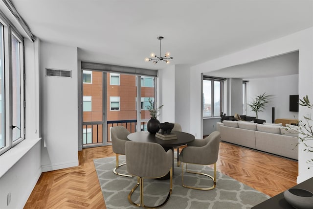 90 E End Ave Unit 10B, New York Manhattan, NY 10028 - dining room featuring a chandelier and baseboards