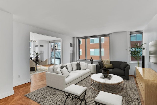 90 E End Ave Unit 10B, New York Manhattan, NY 10028 - living area with a chandelier and baseboards
