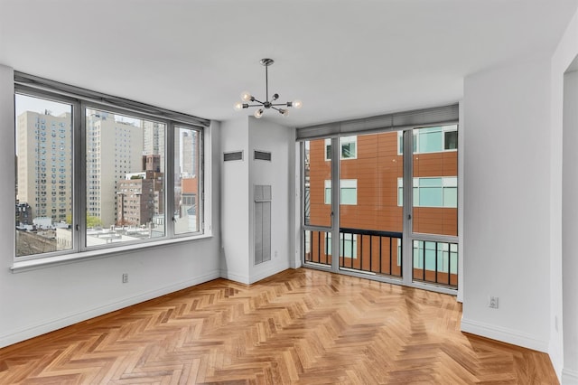 90 E End Ave Unit 10B, New York Manhattan, NY 10028 - unfurnished room with baseboards and a chandelier