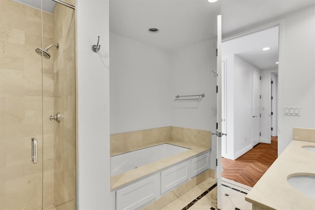 90 E End Ave Unit 10B, New York Manhattan, NY 10028 - bathroom featuring a stall shower, a bath, recessed lighting, and double vanity