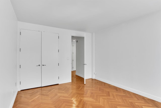 90 E End Ave Unit 10B, New York Manhattan, NY 10028 - unfurnished bedroom featuring baseboards and a closet