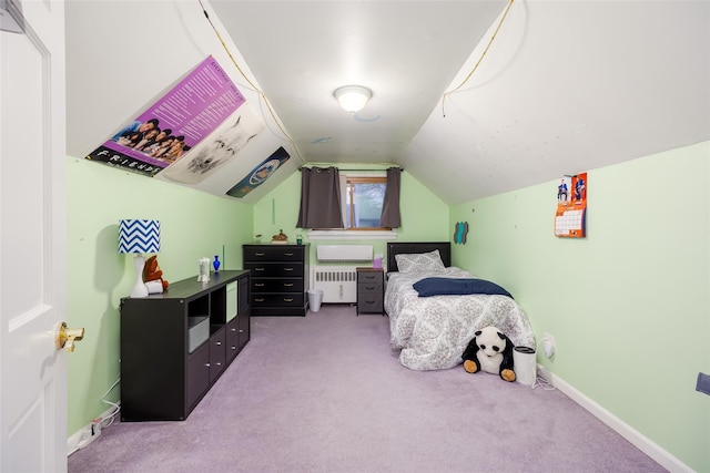 carpeted bedroom featuring radiator heating unit, vaulted ceiling, and baseboards
