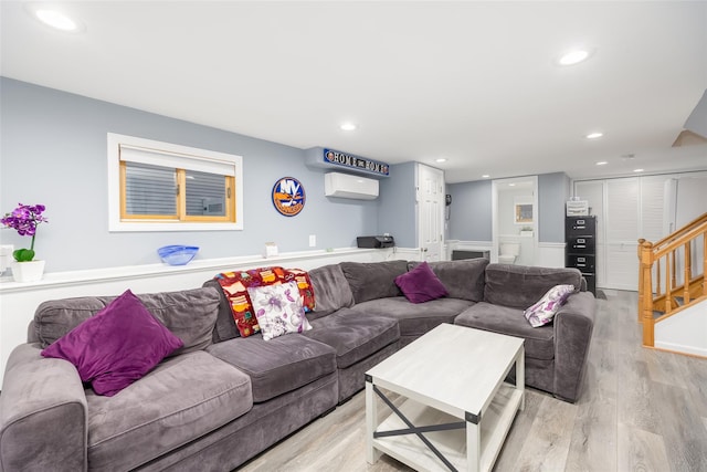 living room with stairs, light wood-style floors, and recessed lighting