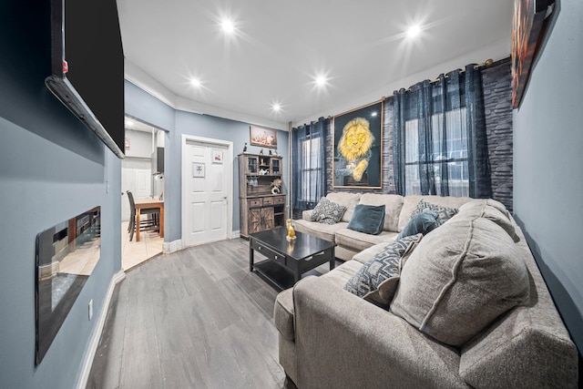 3219 104th St, East Elmhurst, NY 11369 - living room featuring recessed lighting, baseboards, and wood finished floors