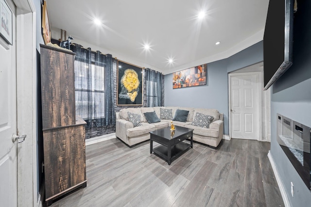 3219 104th St, East Elmhurst, NY 11369 - living room with recessed lighting, baseboards, and wood finished floors