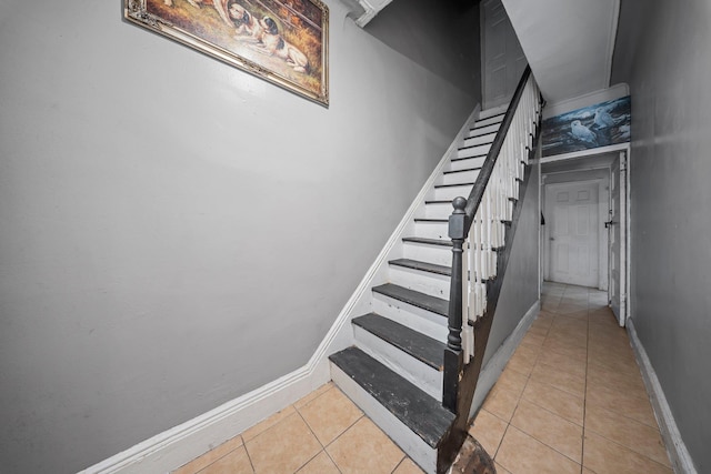 3219 104th St, East Elmhurst, NY 11369 - staircase with baseboards and tile patterned flooring