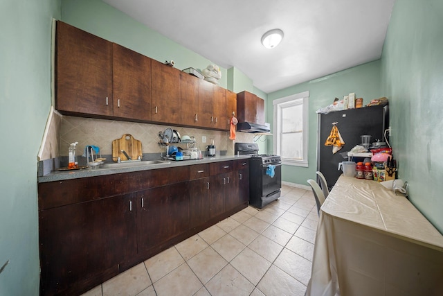 3219 104th St, East Elmhurst, NY 11369 - kitchen with dark brown cabinets, a sink, range with gas stovetop, wall chimney exhaust hood, and tasteful backsplash