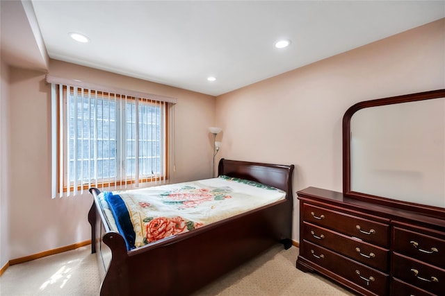 bedroom featuring baseboards, recessed lighting, and light colored carpet