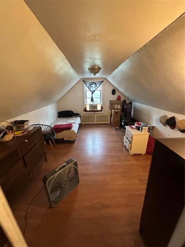 77-29 80th St, Glendale, NY 11385 - bedroom with wood finished floors, vaulted ceiling, and cooling unit