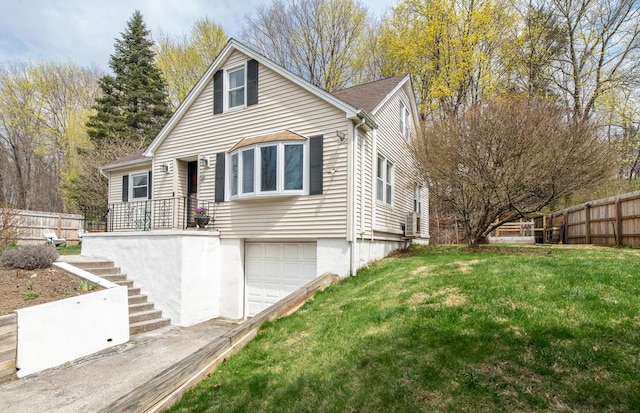 37 Rural Ave, Wingdale, NY 12594 - view of front facade featuring fence, a front lawn, stairs, and a garage