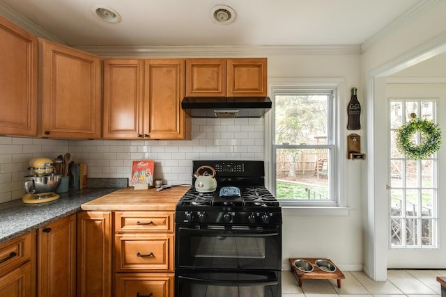 37 Rural Ave, Wingdale, NY 12594 - kitchen with decorative backsplash, double oven range, brown cabinets, light tile patterned floors, and under cabinet range hood