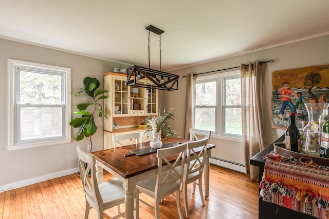 37 Rural Ave, Wingdale, NY 12594 - dining room featuring crown molding, baseboard heating, baseboards, light wood finished floors, and an inviting chandelier