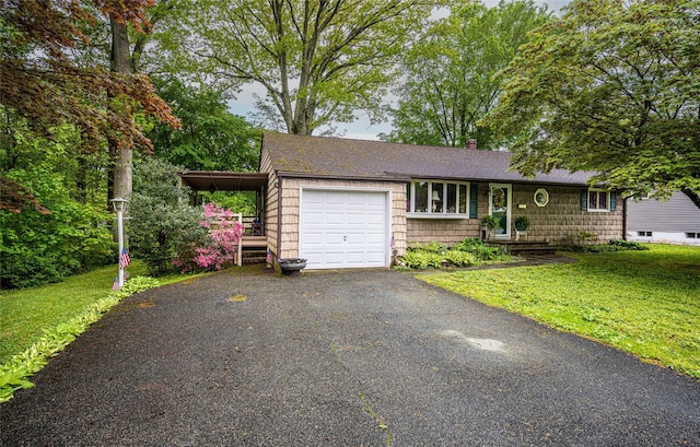 24 Briarbrook Rd, Ossining, NY 10562 - view of front facade featuring an attached garage, a shingled roof, a front yard, and asphalt driveway