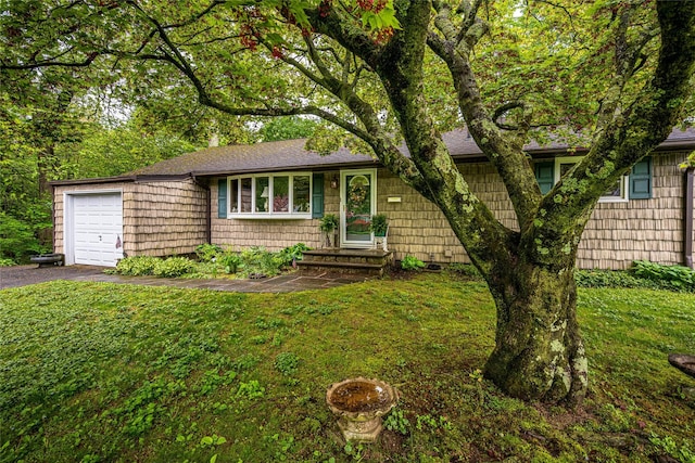 24 Briarbrook Rd, Ossining, NY 10562 - ranch-style house featuring an attached garage, driveway, a front yard, and roof with shingles